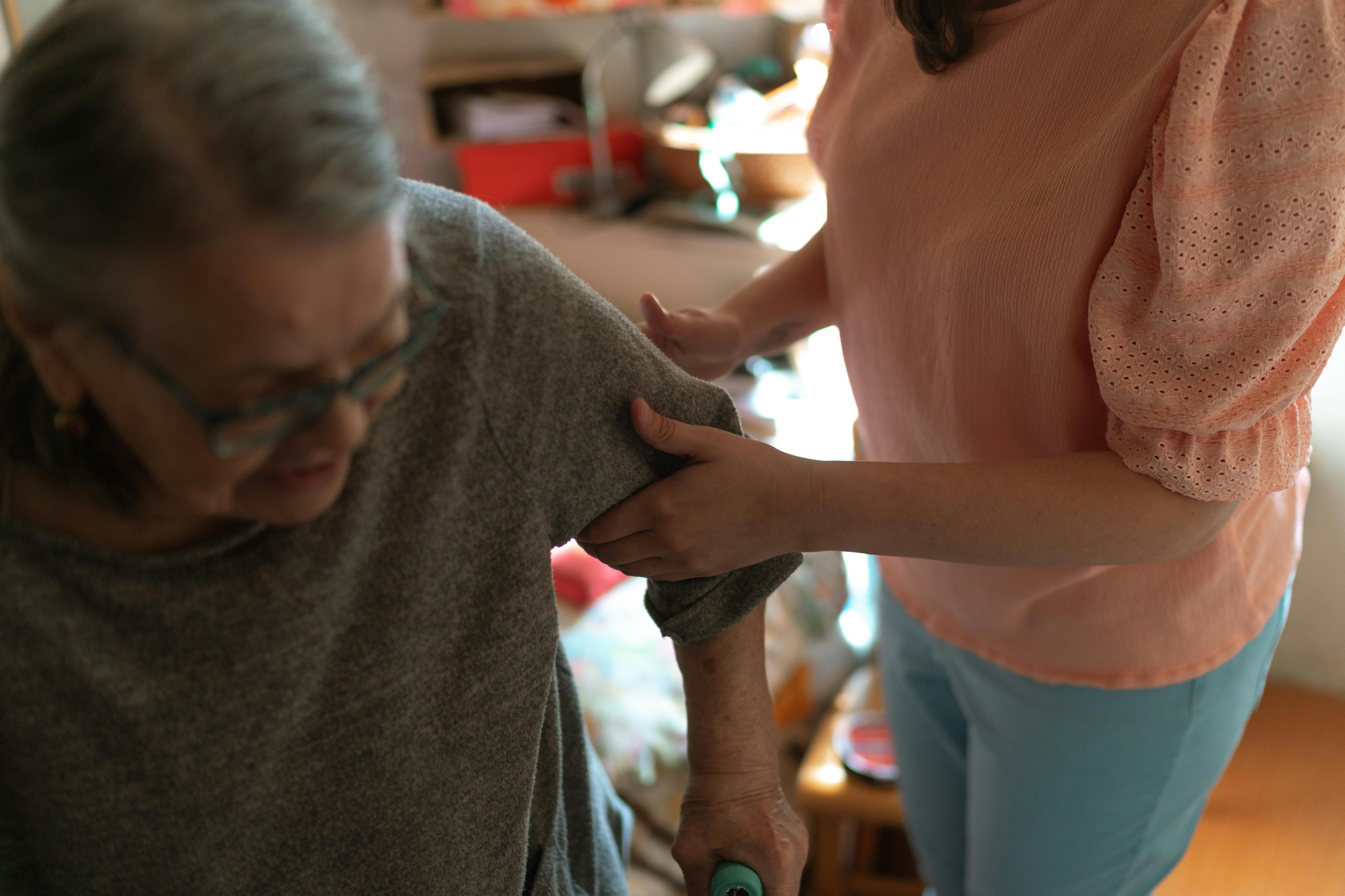 Personal support worker assisting a client